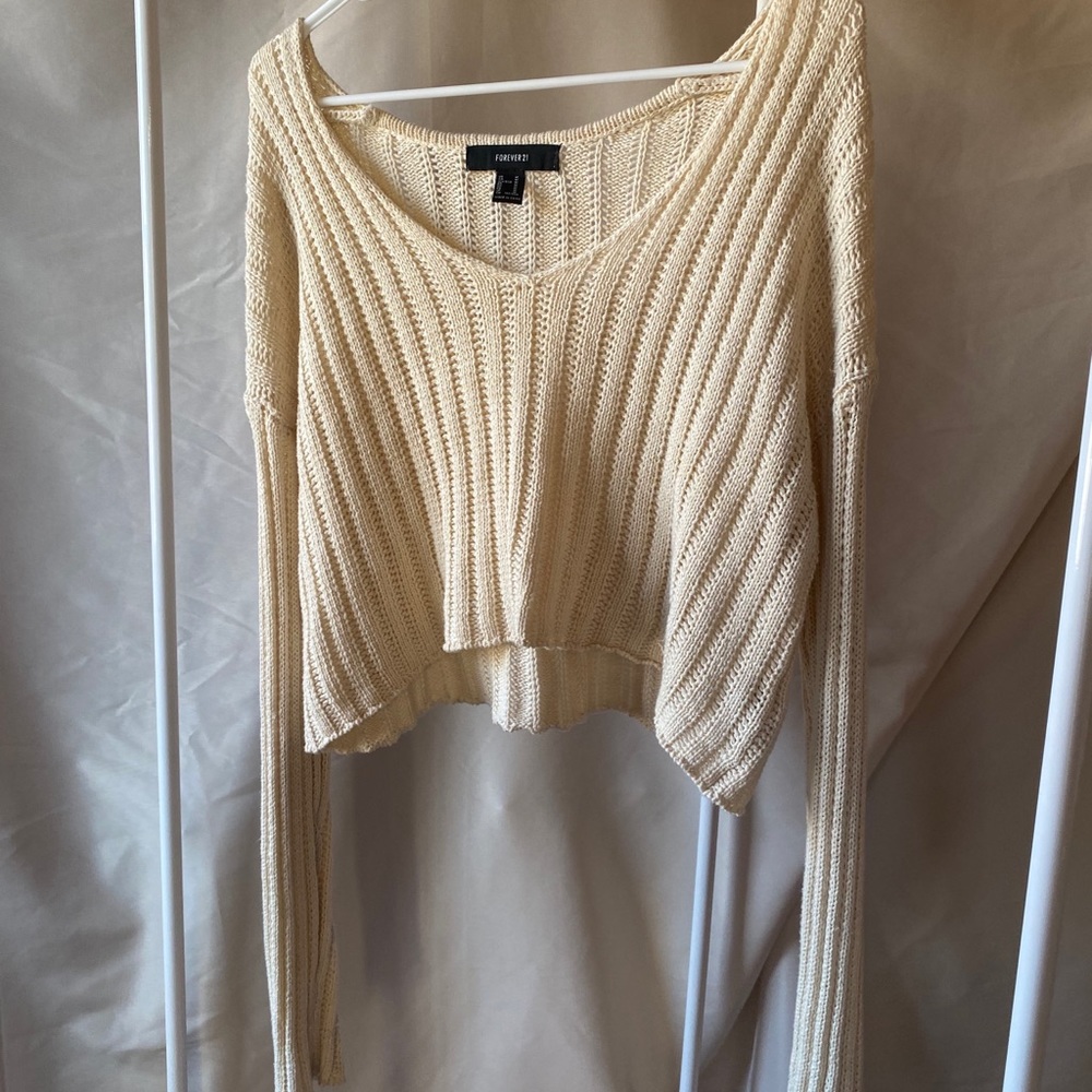 Cream knitted sweater.